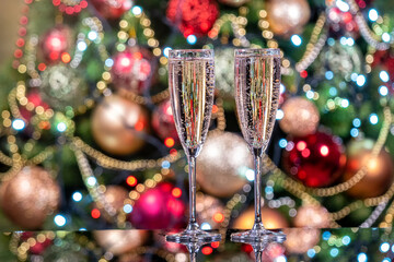 Champagne in two glasses on the background of Christmas bokeh