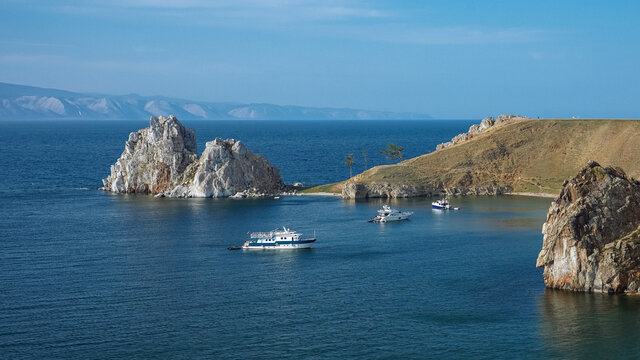Rocky bay with clear blue water and yachts. Stone island. Beautiful European view. Unique nature of Olchon island