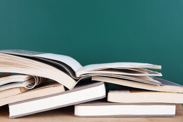 Books in front of the blackboard