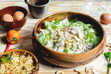 Tuna Salad and Spicy Spaghetti with ingredient  and black coffee on nature wooden backdrop