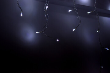 White Christmas LED lights hanging on the wall