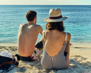 beach couple bathing suit hat ocean sand Galapagos islands Santa Cruz 