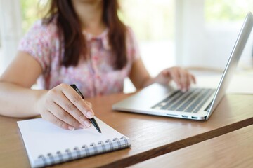 Fototapeta premium Woman working in cafe coronavirus COVID-19 Social distancing keep distance in public society people to protect COVID
