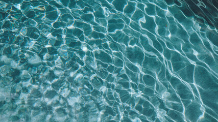 Abstract pool water.  Swimming pool bottom caustics ripple and flow with waves background surface...