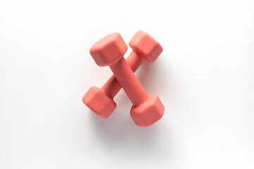 Dumbbells on white background. Fitness, sport and workout concept flat lay