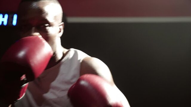 African-American boxers are playing rounds in the gym
