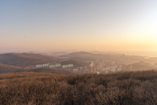 Sunset over the city between the mountains in spring © Tishina
