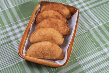Brazilian chicken pastel on the table