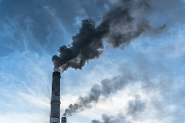 Smoking factory chimneys with co2 emissions.Environmental problem of environmental and air pollution.Climate change,ecology, global warming.The sky is smoky with toxic substances.Soot from factories