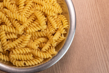 Raw pasta in bowl - macro detail