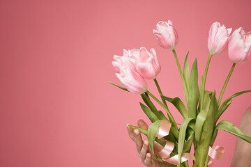 Bouquet of flowers as a gift holiday on March 8 pink background