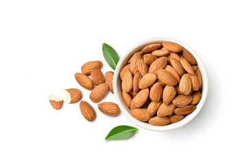 Flat lay (top view) of Almond nuts in white bowl with leaves isolated on white background.