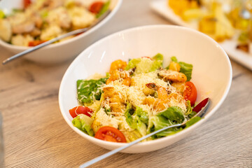 Catering. serving the table with salads for the holiday. ordering ready meals and serving banquets. .