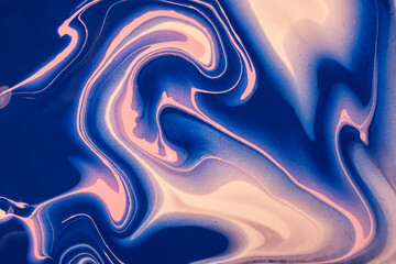 Abstract fluid art background navy blue and pink colors. Liquid marble. Acrylic painting with sapphire gradient.