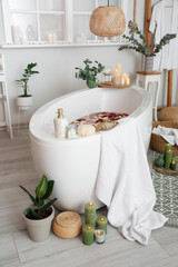 Interior of modern bathroom with burning candles