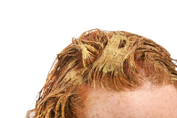 Young woman using henna hair dye on white background, closeup