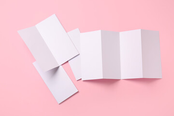 Blank brochures on color background