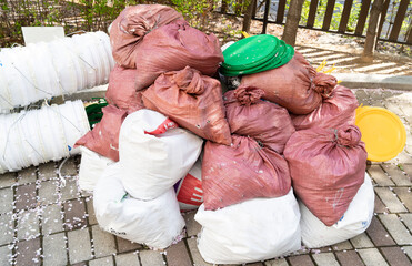 construction wastes packed in bags lying on the street