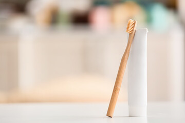 Tooth brush with paste on blurred background
