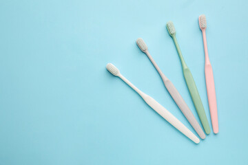 Tooth brushes on color background