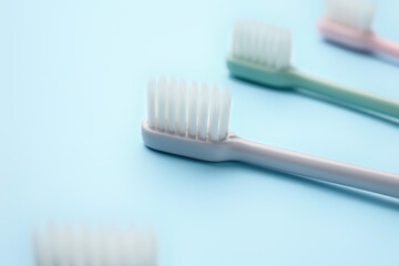 Tooth brushes on color background