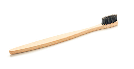 Wooden tooth brush on white background