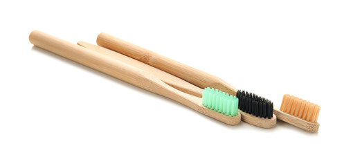 Wooden tooth brushes on white background