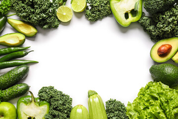 Frame made of fresh green vegetables on white background