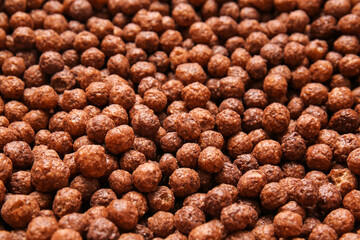 Chocolate corn balls as background, closeup