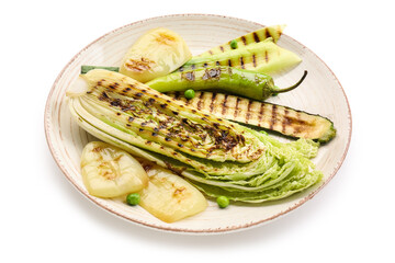 Plate with tasty grilled vegetables on white background