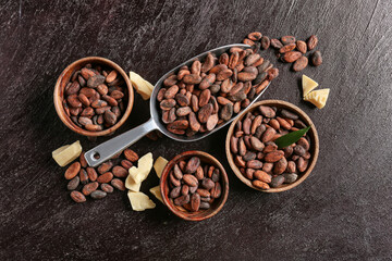 Obraz na płótnie Canvas Composition with cocoa beans on dark background