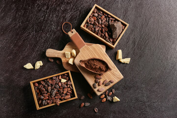 Composition with cocoa beans on dark background