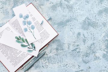 Book with bookmarks on color background