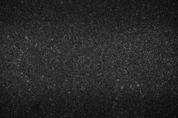 Surface grunge rough of asphalt, Grey grainy road lit in the center and shadows edges, Texture background with vignette, Top view