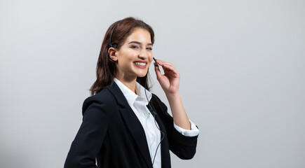 Attractive business woman in suits and headsets are smiling while working isolate on white background. Customer service assistant working in office. VOIP Helpdesk headset