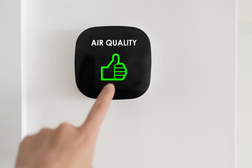 Good air quality indoor smart home domotic touchscreen system. air. Woman touching touchscreen...