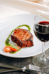 fried pork steak in spices and olive oil and basil dressing
