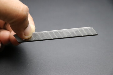 Hobby knife blade spare part held in hand