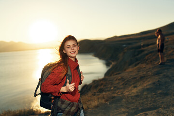 cheerful woman hiker outdoors rocky mountains landscape sun vacation