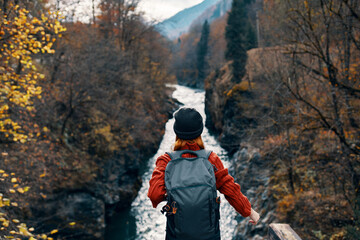 woman hiker backpack mountains river fresh air
