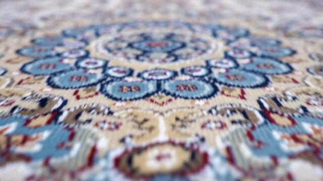 Close-up of patterned carpet camera movement.