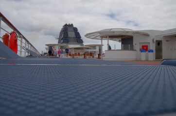 Luxury sun loungers and deck lounge chairs on outside terrace, patio or balcony sun deck of luxury...