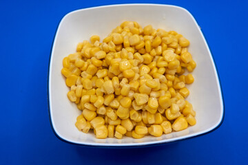 A closeup shot of tinned corn in a bowl