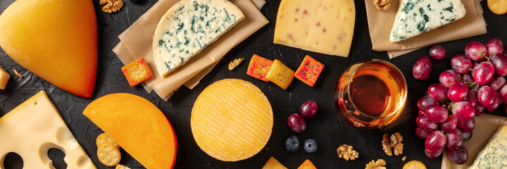 Cheese, wine, and fruit panorama, top shot