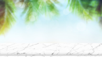 Empty marble table top with sunny tropical beach and palm trees background. Summer background concept
