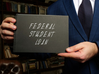 Business concept meaning FEDERAL STUDENT LOAN with phrase on black notepad.