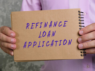 Business concept meaning REFINANCE LOAN APPLICATION with inscription on the page.