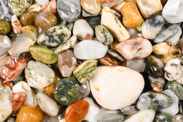 Colorful wet stone pebbles background or rock pebbles texture. High resolution macro closeup for...