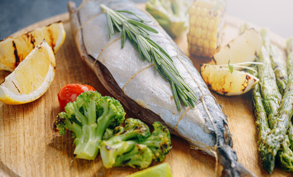 mackerel seasoned with spices and lemon juice ready for grilling