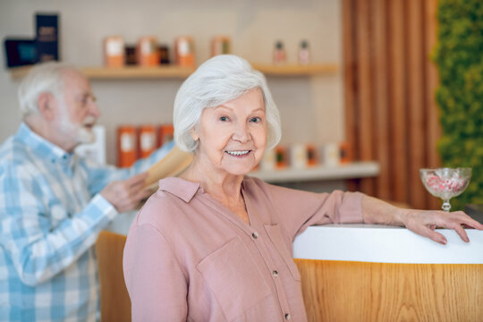Gray-haired woman in a spa center with her husband